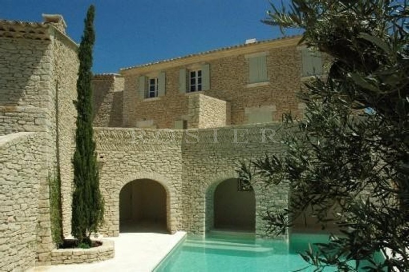 For sale in Gordes, in the village center, very charming stone built 2 storey house with swimming pool and garage