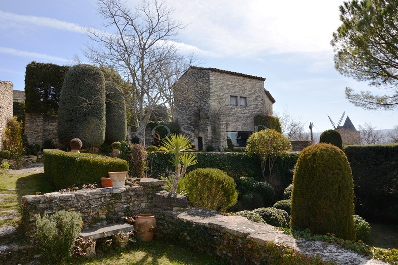 For sale, on the heights of a village, rare town house with garden terrace with views.