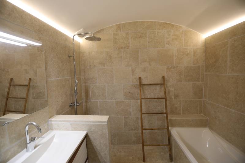 For rent, traditional Provençal stone house near the village of Gordes with pool and panoramic valley views.