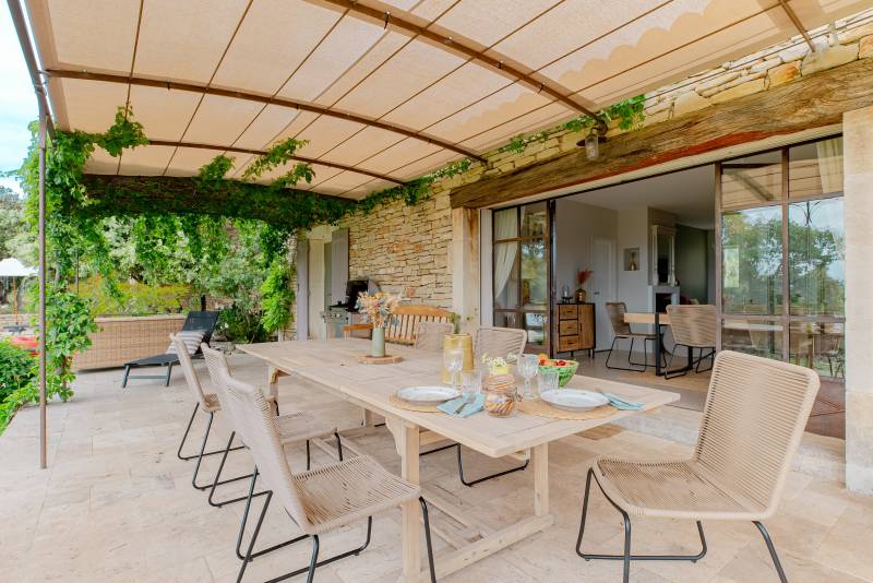 For sale in the hills above Gordes: an 8,500-square-meter property featuring two separate houses and a swimming pool.
