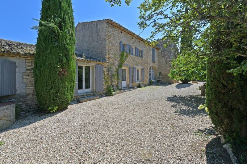 Authentic private stone hamlet with swimming pool and outbuildings set on 6 hectares of Provence in Gordes.