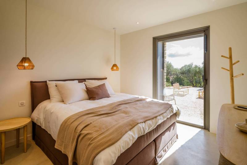 Spectacular contemporary stone villa with a pool, situated on a hilltop overlooking the valley, for sale near Saint-Saturnin-les-Apt.