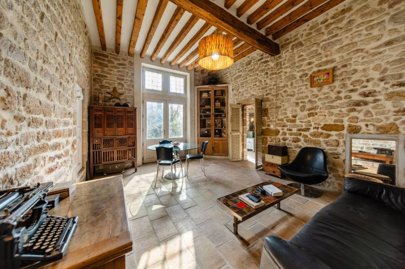 Cosy lounge: A warm relaxation space with garden views and period features.