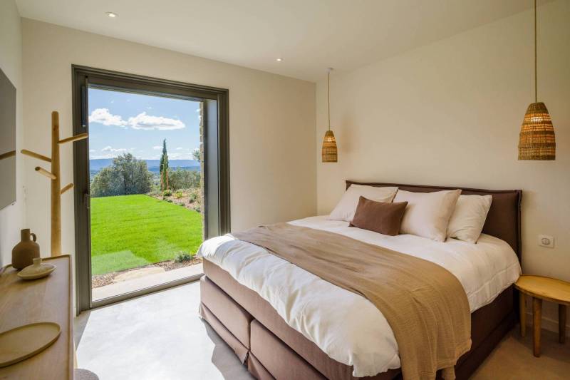 Spectacular contemporary stone villa with a pool, situated on a hilltop overlooking the valley, for sale near Saint-Saturnin-les-Apt.