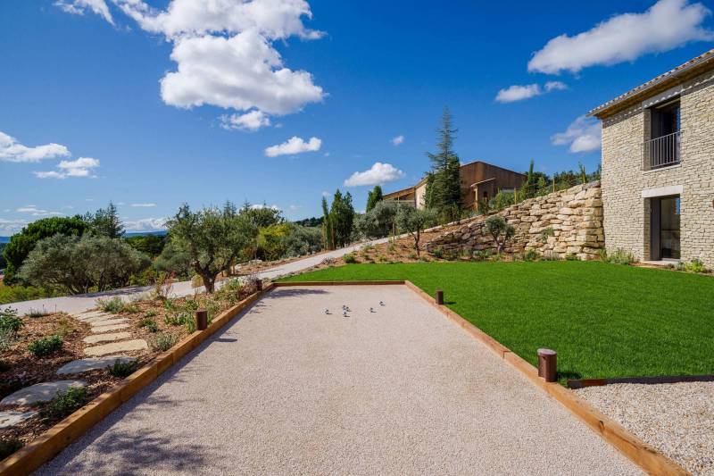 Spectacular contemporary stone villa with a pool, situated on a hilltop overlooking the valley, for sale near Saint-Saturnin-les-Apt.