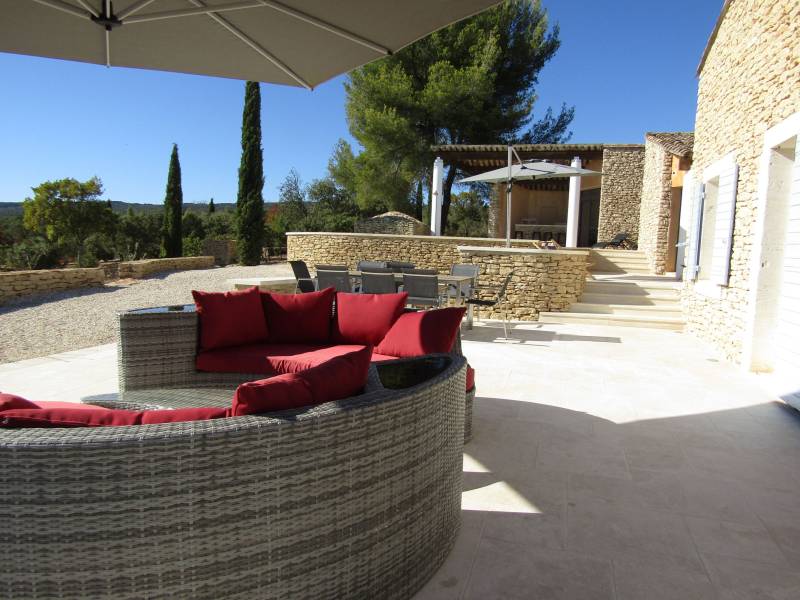 For rent, traditional Provençal stone house near the village of Gordes with pool and panoramic valley views.