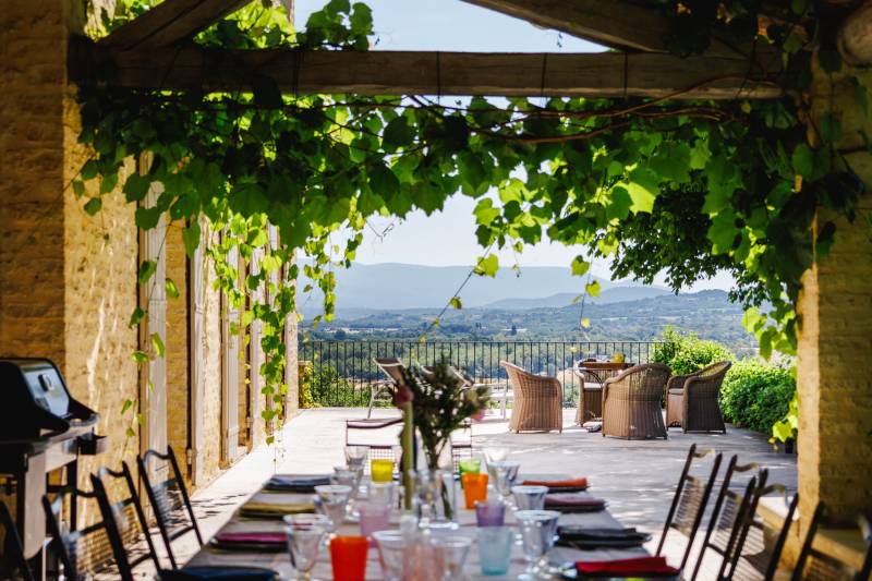 For rent in Gordes, stone Bastide in an elevated position with Luberon views, spacious grounds, and pool.