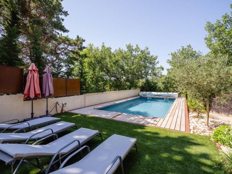 SOLD - Near the village of Gordes, semi-detached hamlet house, perfectly restored with terraced garden, swimming pool, and parking.