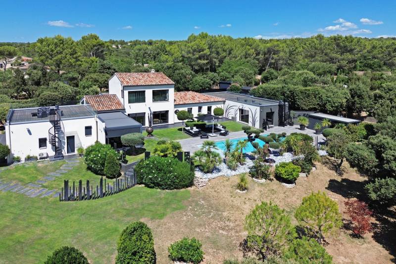 remarkable contemporary villa of approximately 380 sqm, built in 2019 and extended in 2020, stands out with its bold architectural style and high-end amenities