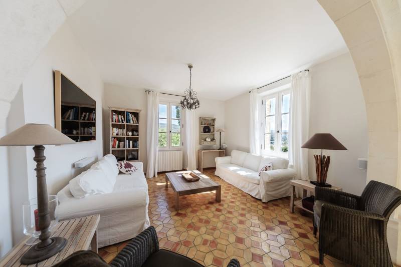 For rent in Gordes, stone Bastide in an elevated position with Luberon views, spacious grounds, and pool.