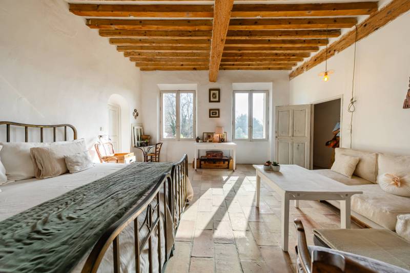 Master bedroom: Spacious, light-filled suite with dual aspect and antique parquet flooring.