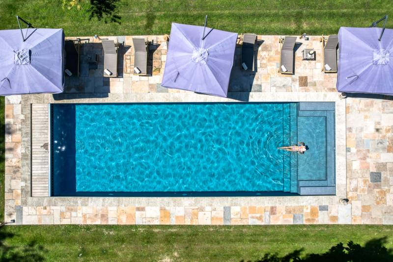 For rent near L’Isle-sur-la-Sorgue, beautifully renovated Mas with high-end amenities, 11 bedrooms, swimming pool and riverfront setting.