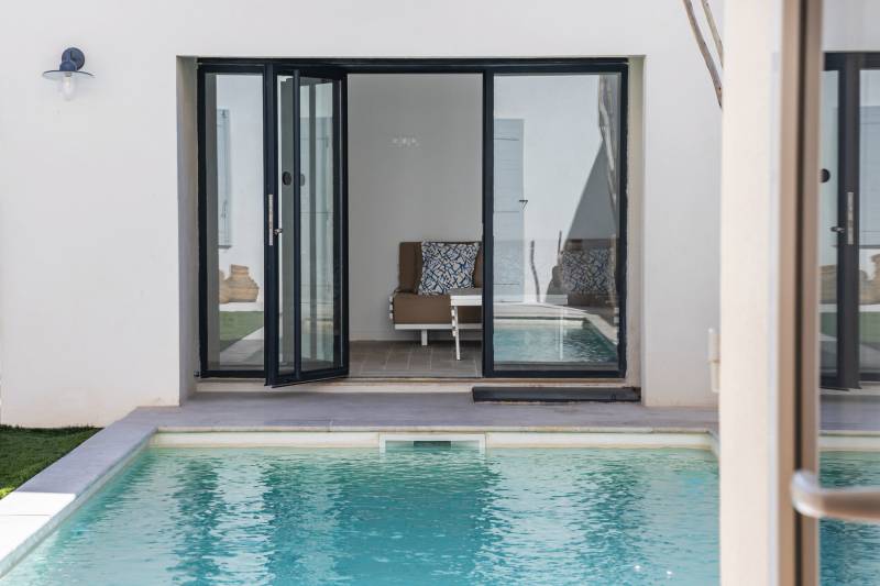 Direct pool access from the living room. Experience the seamless indoor-outdoor Provencal lifestyle