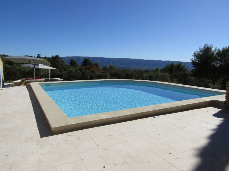 For rent, traditional Provençal stone house near the village of Gordes with pool and panoramic valley views.