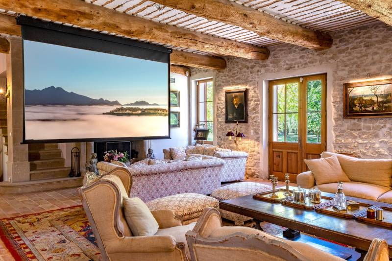 For rent near L’Isle-sur-la-Sorgue, beautifully renovated Mas with high-end amenities, 11 bedrooms, swimming pool and riverfront setting.