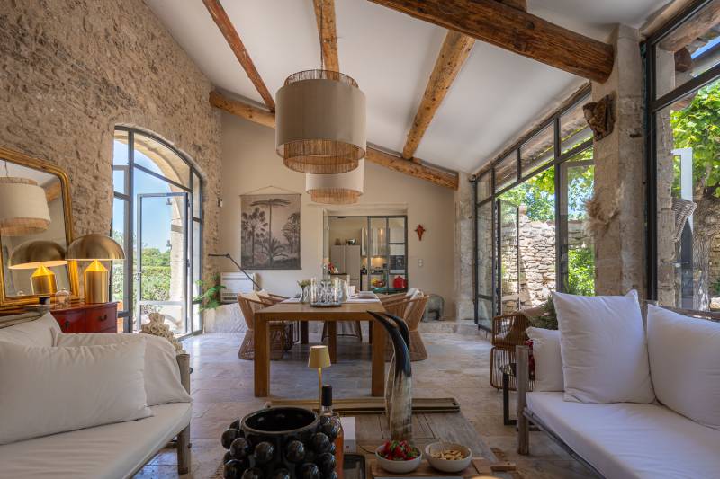 For rent near Gordes, superb renovated hamlet with eight bedrooms, swimming pool, orangery and views over the Luberon.