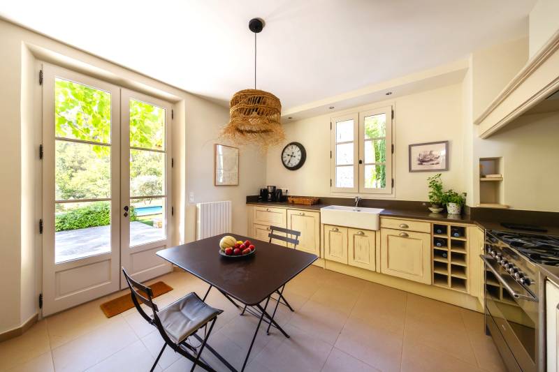 For rent in Gordes, stone Bastide in an elevated position with Luberon views, spacious grounds, and pool.