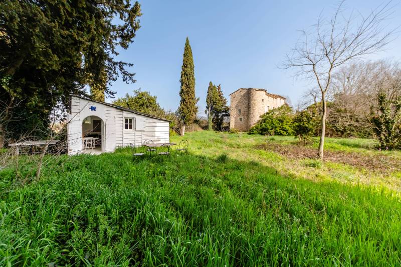Guest cottage: A charming wooden outbuilding nestled in the park, a peaceful haven for visitors.