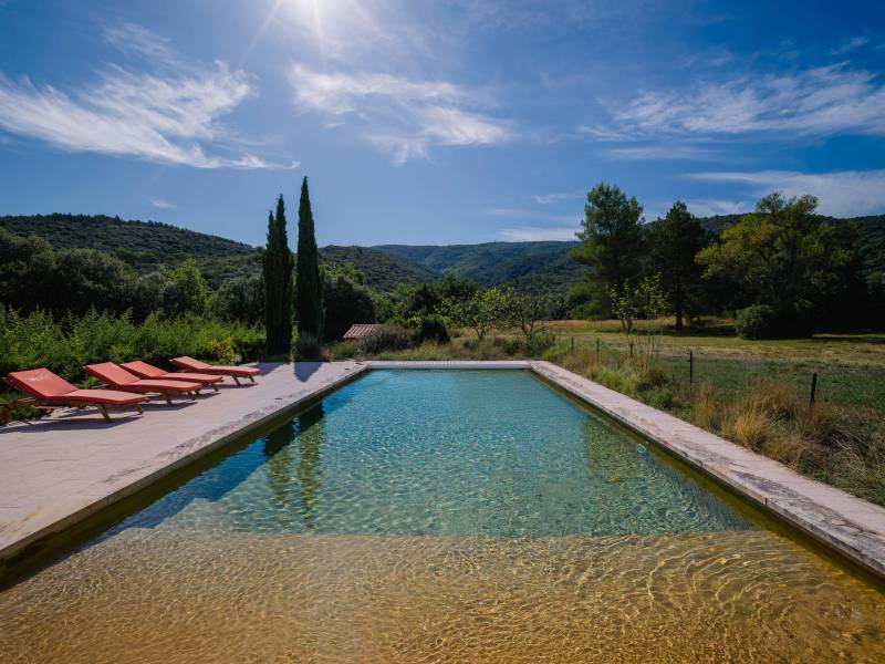 Exceptional pool area (13m x 5.5m) offering panoramic views of the Monts de Vaucluse and the preserved nature of Méthamis.