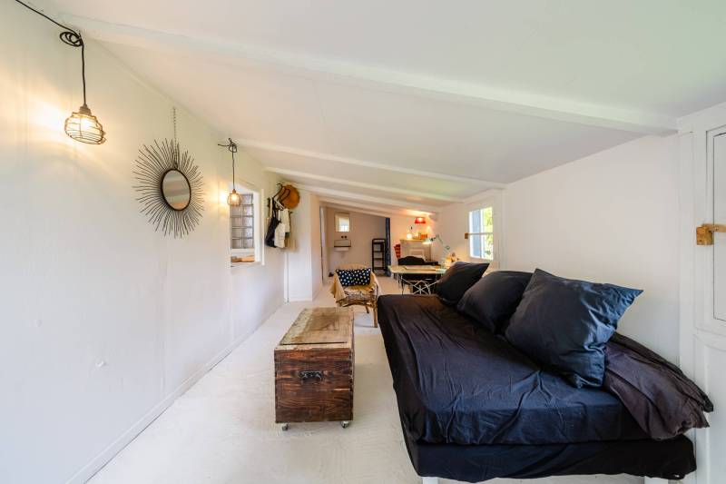 Guest cottage: A charming wooden outbuilding nestled in the park, a peaceful haven for visitors.