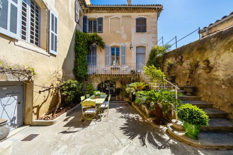 Stately stone manor house with classical architectural symmetry, perfectly positioned in the heart of Provence.
