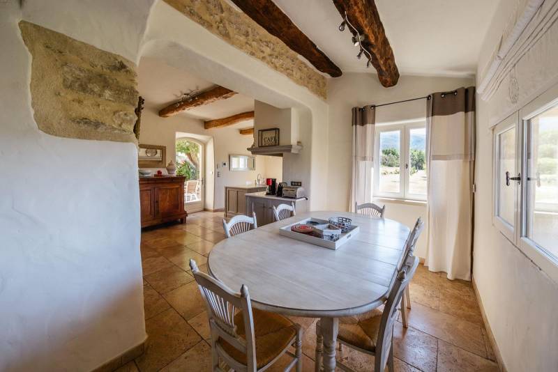 For sale, elegant stone house property with views of Bonnieux and Lacoste, recently restored with high-end amenities and separated annexes.