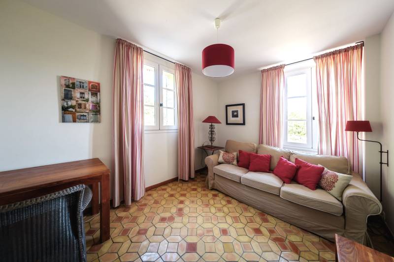 For rent in Gordes, stone Bastide in an elevated position with Luberon views, spacious grounds, and pool.