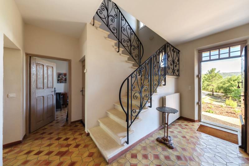 For rent in Gordes, stone Bastide in an elevated position with Luberon views, spacious grounds, and pool.