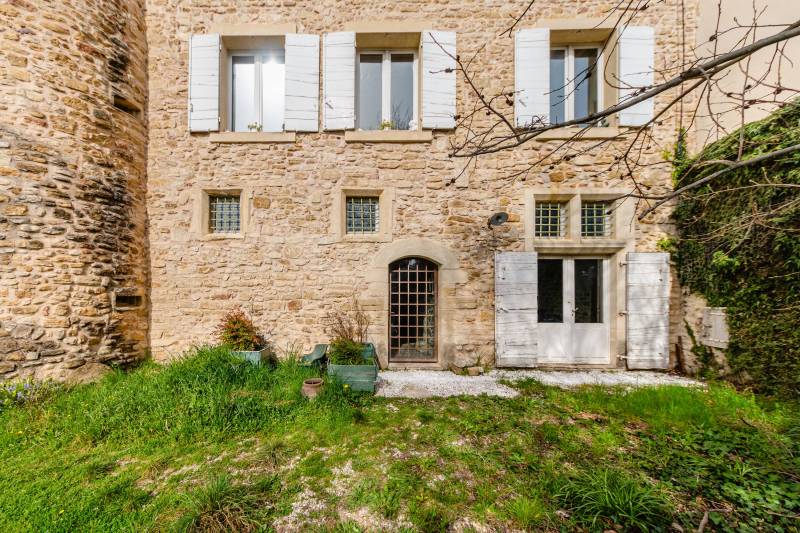 Timeless charm: South-facing façade featuring mullioned windows and restored period woodwork.