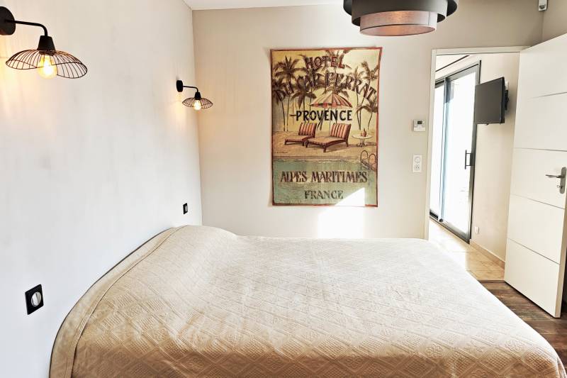 For sale in Gordes: a single-story stone house with a pool and garage in a quiet residential neighborhood.