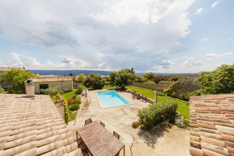Gordes: rare village property in dominant position with swimming pool and outbuildings walking distance to the center.