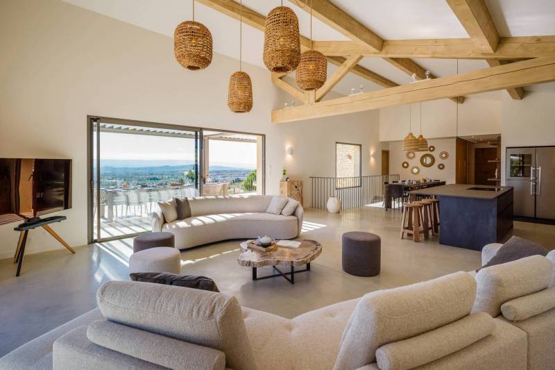 Spectacular contemporary stone villa with a pool, situated on a hilltop overlooking the valley, for sale near Saint-Saturnin-les-Apt.
