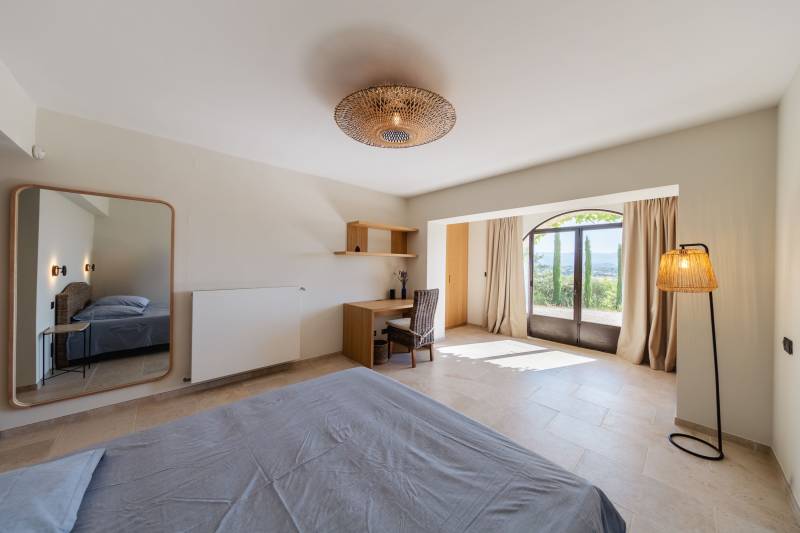 For rent in Gordes, stone Bastide in an elevated position with Luberon views, spacious grounds, and pool.