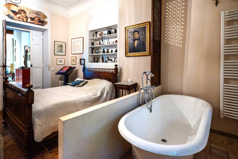 In the village of Cabrières-d'Avignon, a historic stone mansion with a swimming pool and garden near the castle.