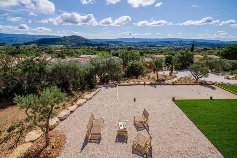 Spectacular contemporary stone villa with a pool, situated on a hilltop overlooking the valley, for sale near Saint-Saturnin-les-Apt.
