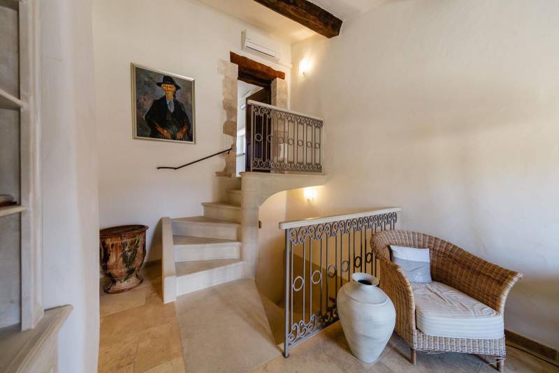 For sale, elegant stone house property with views of Bonnieux and Lacoste, recently restored with high-end amenities and separated annexes.