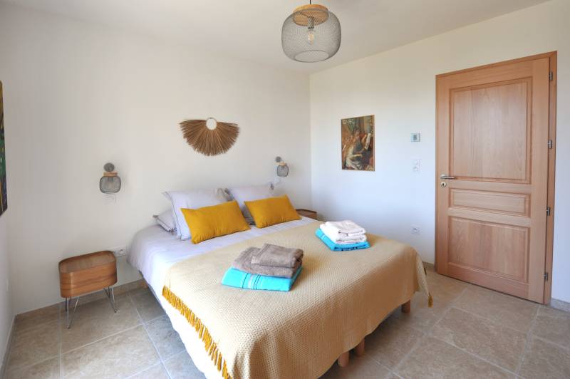 Contemporary stone villa within walking distance of Gordes, with heated pool, panoramic views and elegant outdoor living spaces.
