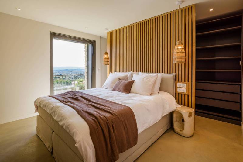 Spectacular contemporary stone villa with a pool, situated on a hilltop overlooking the valley, for sale near Saint-Saturnin-les-Apt.