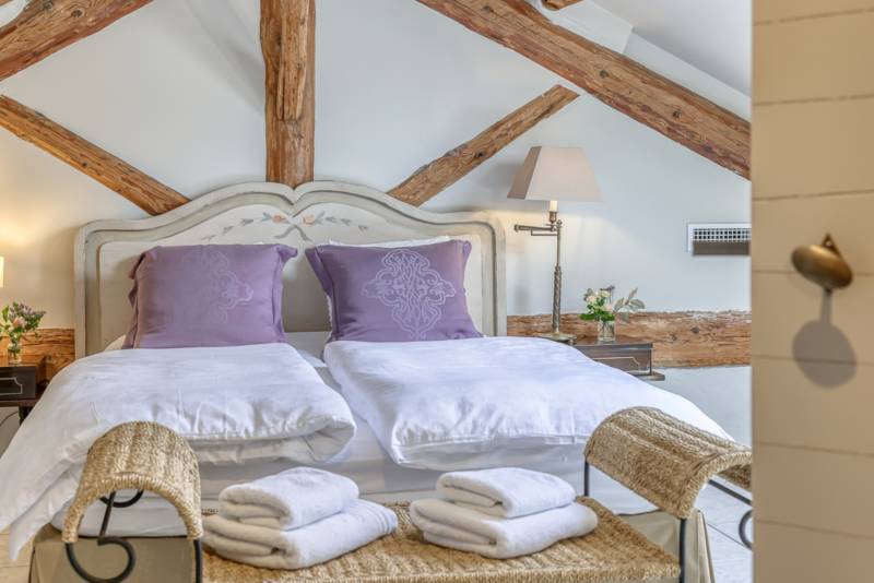 For rent near L’Isle-sur-la-Sorgue, beautifully renovated Mas with high-end amenities, 11 bedrooms, swimming pool and riverfront setting.