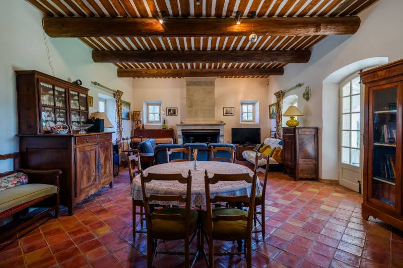 For sale in Cabrières-d’Avignon, stone house in a commanding position with landscaped grounds offering beautiful views of the Luberon.