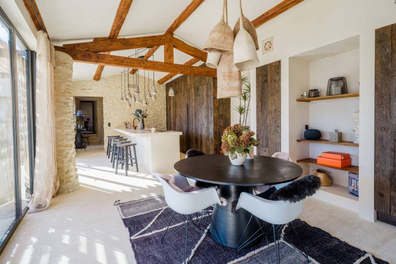 In a hamlet of Gordes, a renovated former sheepfold with a garden, swimming pool, and terrace offering views of the Luberon.