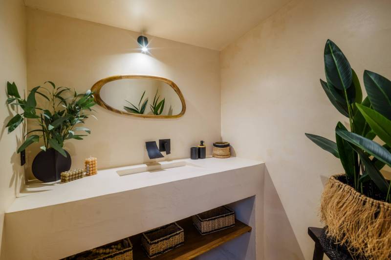 In a hamlet of Gordes, a renovated former sheepfold with a garden, swimming pool, and terrace offering views of the Luberon.