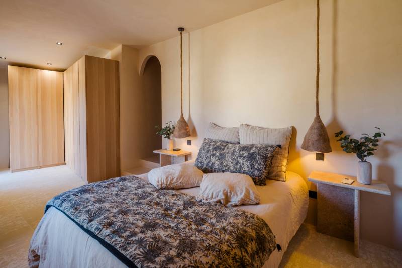 In a hamlet of Gordes, a renovated former sheepfold with a garden, swimming pool, and terrace offering views of the Luberon.