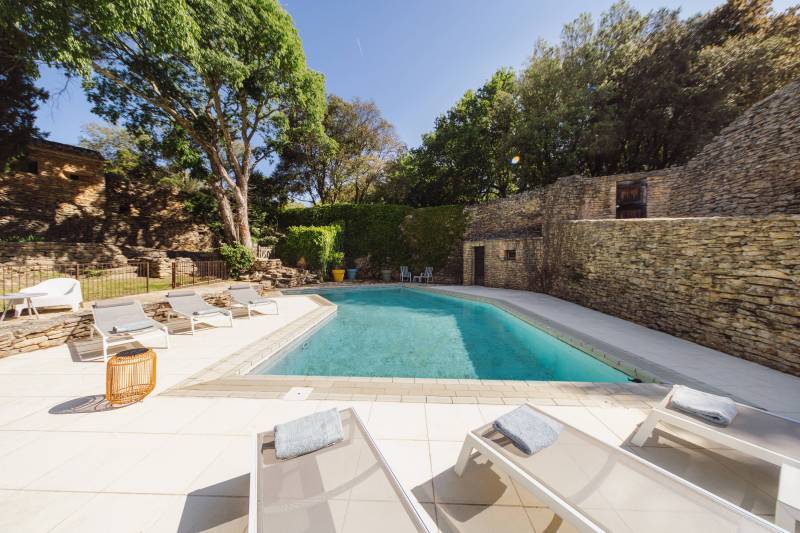 For rent, charming stone house with pool, in a peaceful setting just steps from the center of Gordes village.