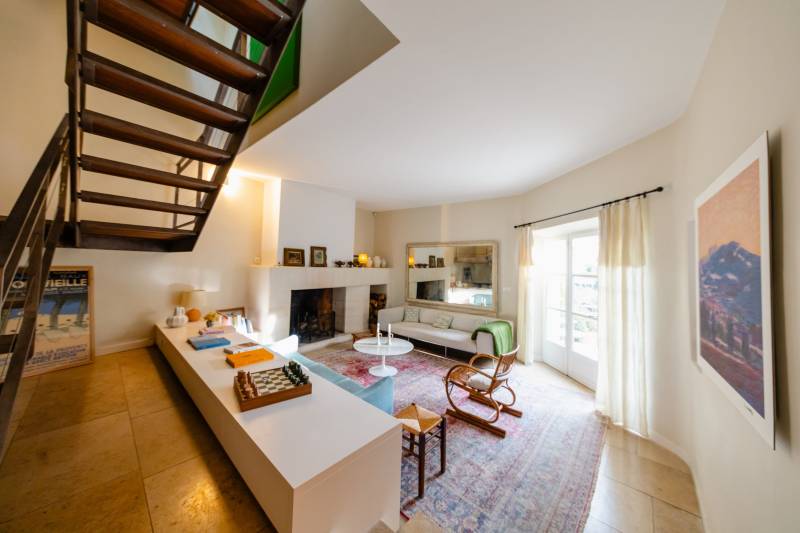 In Gordes, in the heart of a sought-after hamlet, for sale a superb restored 18th-century stone house with two outbuildings set in an enclosed garden featuring a pond.