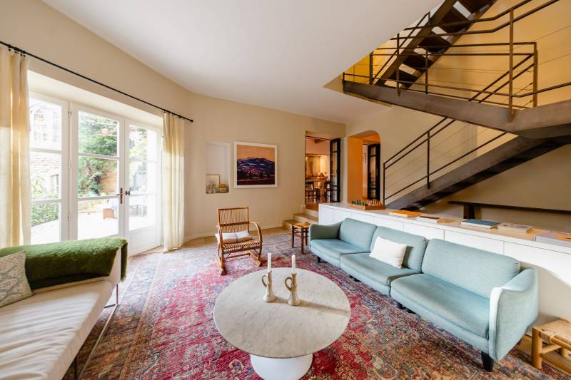 In Gordes, in the heart of a sought-after hamlet, for sale a superb restored 18th-century stone house with two outbuildings set in an enclosed garden featuring a pond.
