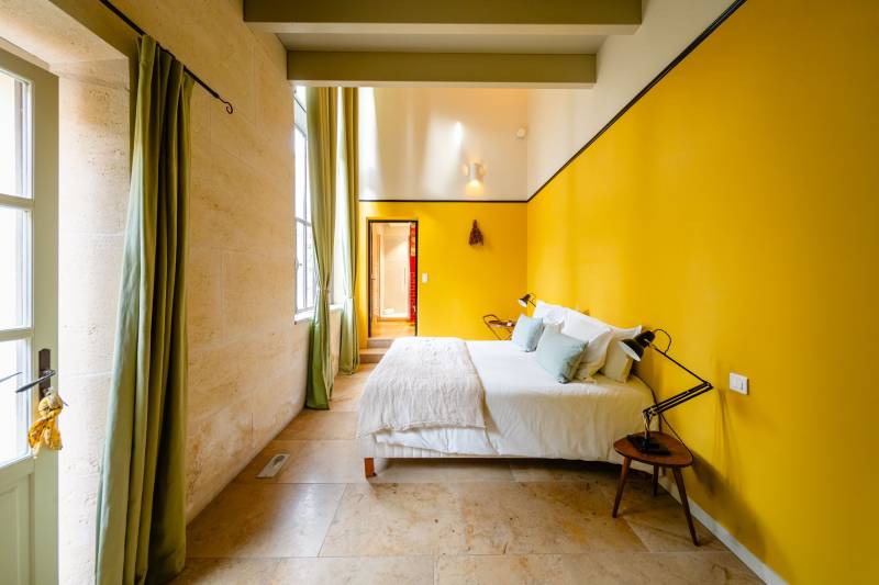 In Gordes, in the heart of a sought-after hamlet, for sale a superb restored 18th-century stone house with two outbuildings set in an enclosed garden featuring a pond.