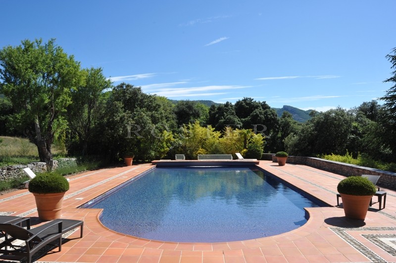 For sale, in Luberon by ROSIER, large property including the main house, a park over 35 hectares (86 acres), guest house, friend house, heated swimming pool, pool house, tennis court