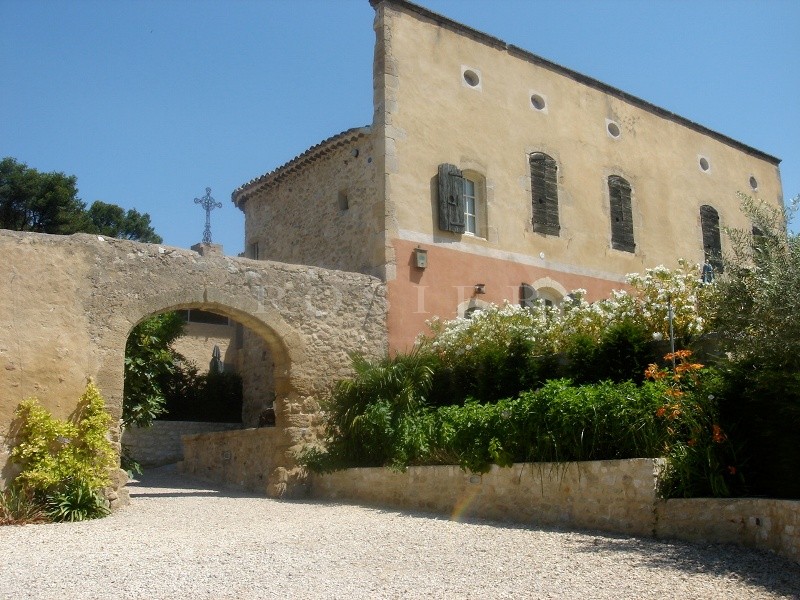 Between Luberon and Alpilles, for sale, provencal castle with outbuildings, on several hectares of hilly land with swimming pool