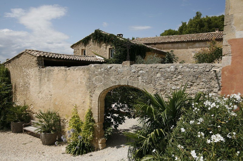 Between Luberon and Alpilles, for sale, provencal castle with outbuildings, on several hectares of hilly land with swimming pool